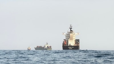 Containerships anchor near the Bab al-Mandeb Strait off Yemen’s coast in the Gulf of Aden. Containerships anchor near the Bab al-Mandeb Strait off Yemen’s coast in the Gulf of Aden.