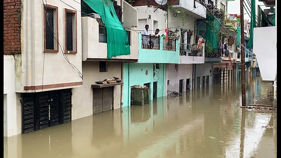 A view of a waterlogged residential area after heavy rainfall in Gaus Nagar, in Prayagraj on Tuesday. (ANI Video Grab)