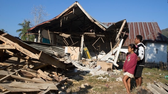People inspect earthquake-damaged houses in North Lamba Leda, East Nusa Tenggara province, Indonesia, Tuesday, Aug. 18, 2026. (AP)