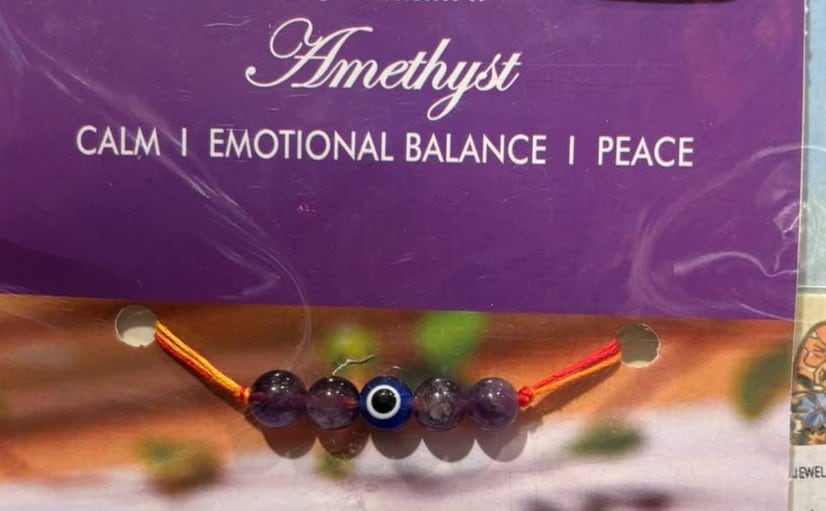 Amethyst stone rakhi with evil eye charm brings peace and calmness into the wearer's life. Price:  ₹195