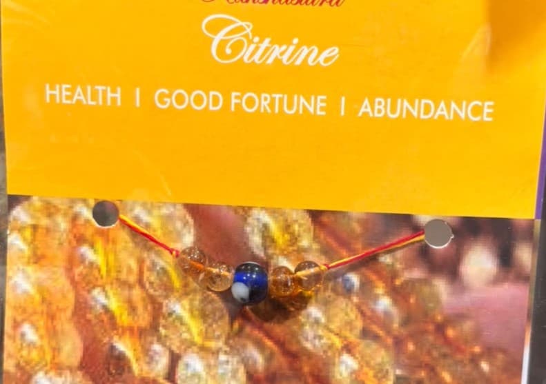 Citrine rakhi with evil eye charm promotes better health when the stones touch the skin of the wearer for a long duration. Price:  ₹195