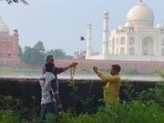 ABHM activists offering symbolic prayers at Mehtab Bagh in Agra, considering the Taj Mahal as a Shiva Temple, on the third Monday of Sawan. (Sourced)