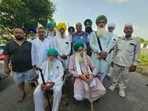 BKU (Ekta Sidhupur) leader Jagjit Singh Dallewal (right) and others during their protest at Khanauri on Tuesday. (HT Photo)
