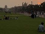 In Connaught Place, after sundown, a bald man in a black suit and tie is sitting alone, without even a mobile phone, on a low cement ledge close to Anil Book Corner, shut for the day. He is looking down. (HT Photo)