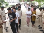 NEET 2026 exam cancelled LIVE updates: Security persons checking aspirants before appearing in the NEET-UG 2026 exam conducted by NTA at an examination centre, Magadh Mahila College in Patna, Bihar