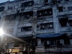 Charred portion of the exterior of a building after a fire broke out at a hotel on Mirza Galib Street, leaving at least nine people dead and six others injured