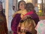 Shriya Saran's daughter Radha clung to her as she got photographed. 