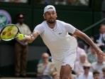 Australia's Nick Kyrgios returns to Serbia's Novak Djokovic in the final of the men's singles during the Wimbledon tennis championships in London, July 10, 2022