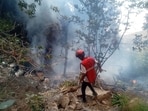 A rescue official works at the site of a tourist helicopter crash that caused multiple casualties, according to the police, in Samburu County, Kenya, August 19, 2026.