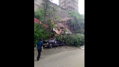 A vehicle buried under the debris after landslide during rain near Bhattakufer, Shimla, on Wednesday. (Deepak Sansta/ HT) A vehicle buried under the debris after landslide during rain near Bhattakufer, Shimla, on Wednesday. (Deepak Sansta/ HT)