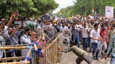 Successful candidates enter Jharkhand secretariat campus protesting exam cancellations (PTI)