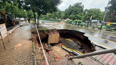 The caved-in portion of the Sector 26–28 dividing road near the transport light point. (Ravi Kumar/HT) The caved-in portion of the Sector 26–28 dividing road near the transport light point. (Ravi Kumar/HT)