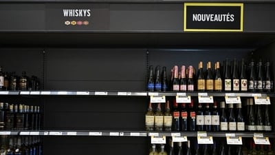 Empty space on a shelf where American-made liquor had been at a store in Montreal. Empty space on a shelf where American-made liquor had been at a store in Montreal.