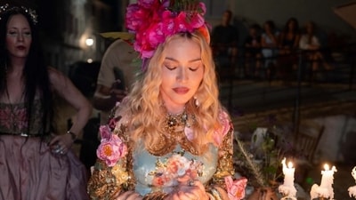 Dressed in custom Dolce & Gabbana couture, the “Material Girl” singer posted photo carousels from the trip with her own chaotic caption (Photo: Instagram)