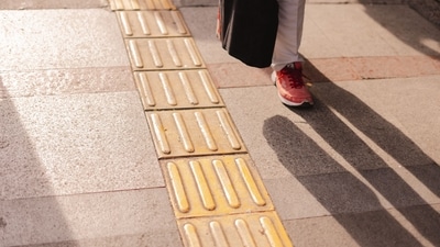 The yellow tiles with raised patterns are to help the visually impaired navigate the urban landscape. (Pexel) The yellow tiles with raised patterns are to help the visually impaired navigate the urban landscape. (Pexel)