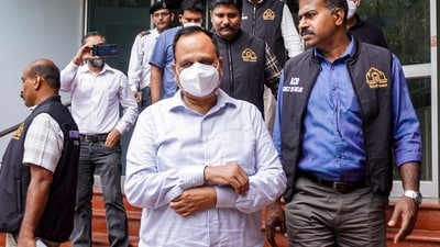 AAP leader Satyendar Jain, centre, being produced before the court after an arrest by the Anti-Corruption Branch in connection with an alleged corruption case involving the tendering process for sewage treatment plant projects of the Delhi Jal Board (PTI) AAP leader Satyendar Jain, centre, being produced before the court after an arrest by the Anti-Corruption Branch in connection with an alleged corruption case involving the tendering process for sewage treatment plant projects of the Delhi Jal Board (PTI)