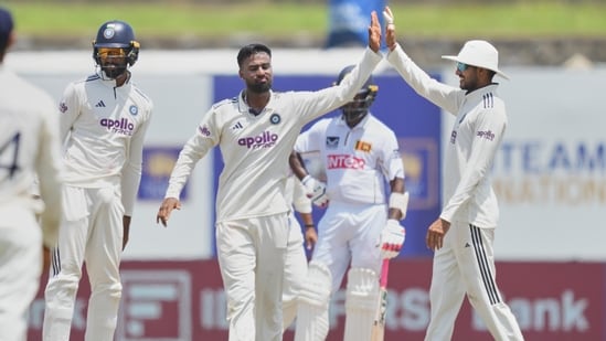India's Manav Suthar celebrates the dismissal of Sri Lanka's Sonal Dinusha with teammates.