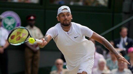 Australia's Nick Kyrgios returns to Serbia's Novak Djokovic in the final of the men's singles during the Wimbledon tennis championships in London, July 10, 2022