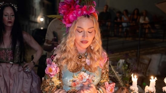 Dressed in custom Dolce & Gabbana couture, the “Material Girl” singer posted photo carousels from the trip with her own chaotic caption (Photo: Instagram)