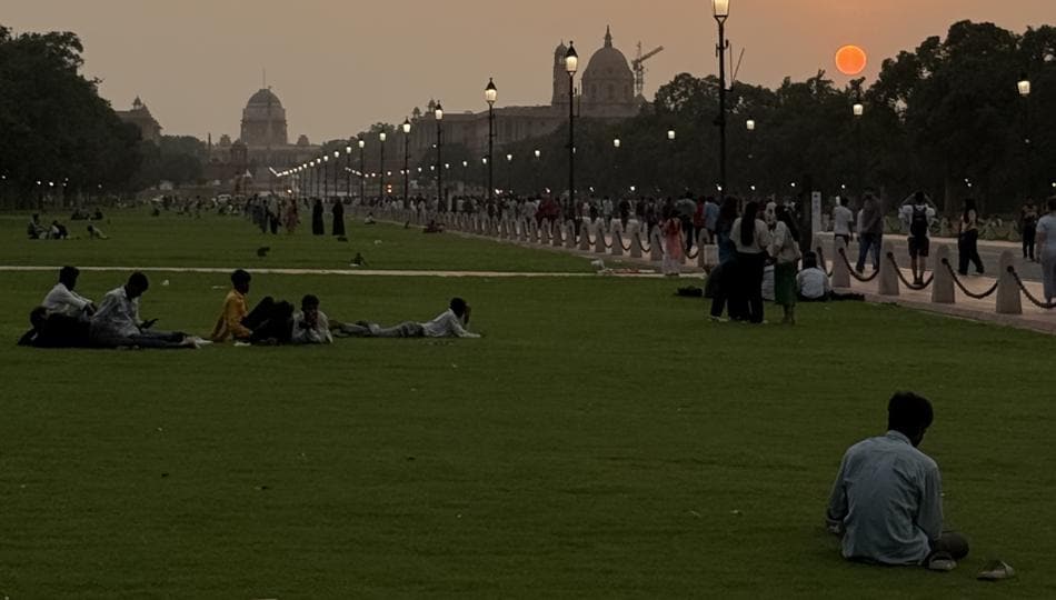 In Connaught Place, after sundown, a bald man in a black suit and tie is sitting alone, without even a mobile phone, on a low cement ledge close to Anil Book Corner, shut for the day. He is looking down. (HT Photo) (HT_PRINT) In Connaught Place, after sundown, a bald man in a black suit and tie is sitting alone, without even a mobile phone, on a low cement ledge close to Anil Book Corner, shut for the day. He is looking down. (HT Photo) (HT_PRINT)