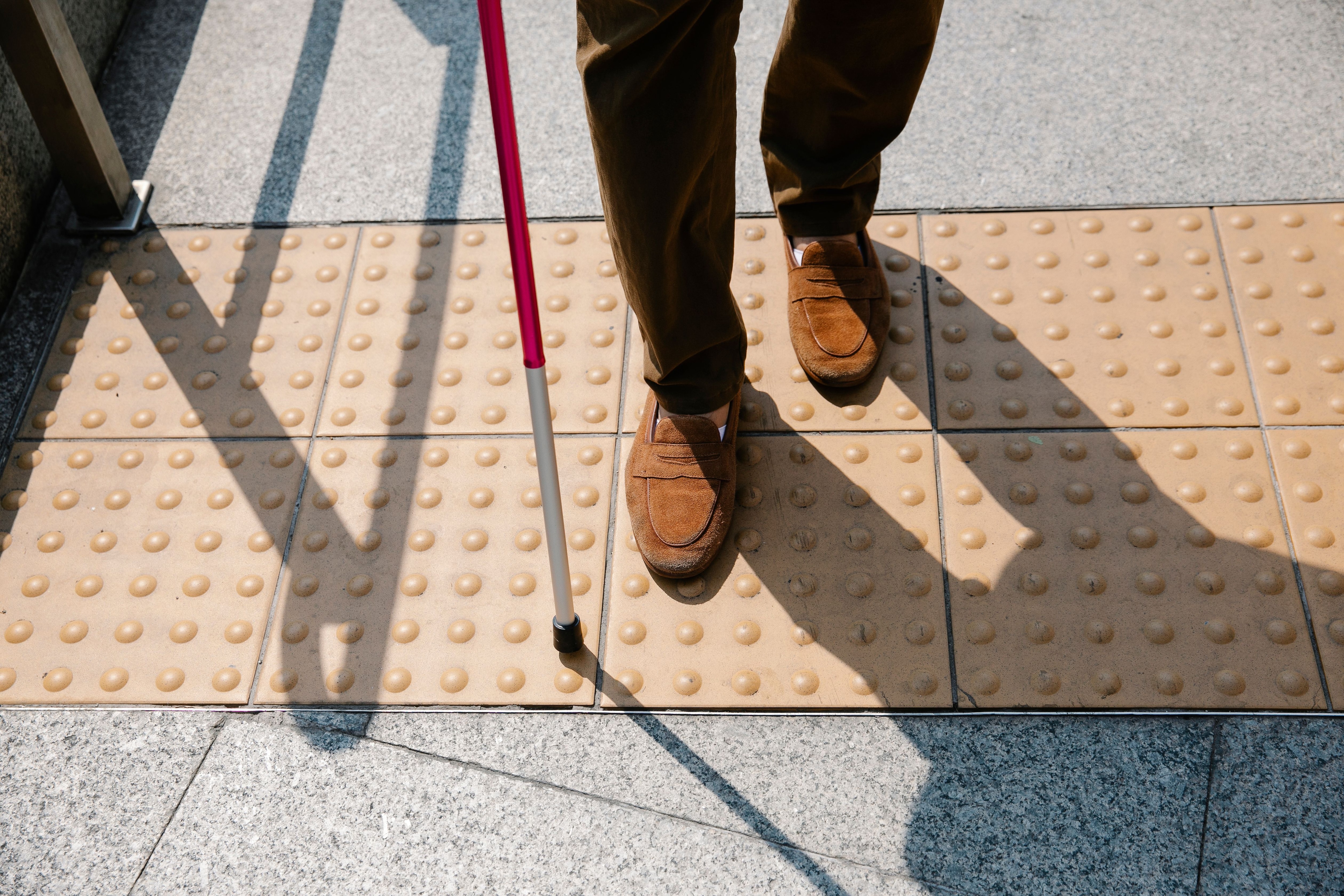 Yellow tiles with raised dots suggest a need to stop. (Pexel) Yellow tiles with raised dots suggest a need to stop. (Pexel)