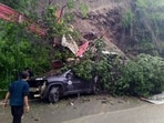 A vehicle buried under the debris after landslide during rain near Bhattakufer, Shimla, on Wednesday. (Deepak Sansta/ HT) A vehicle buried under the debris after landslide during rain near Bhattakufer, Shimla, on Wednesday. (Deepak Sansta/ HT)