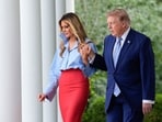 US First Lady Melania Trump, left, and US President Donald Trump arrive for a Fostering the Future event in the Rose Garden of the White House in Washington, DC, US. US First Lady Melania Trump, left, and US President Donald Trump arrive for a Fostering the Future event in the Rose Garden of the White House in Washington, DC, US.
