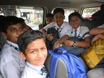 Overcrowded school vans ferry children near schools in Hazratganj. (Mushtaq Ali/HT)