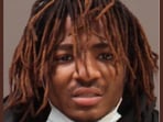 Philadelphia police have identified Zymire Hughes as the masked man accused of chasing and threatening residents near City Hall. 