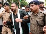 Police detain RJD national working president Tejashwi Yadav during a protest march towards the Bihar Lok Bhawan in Patna, Wednesday. (SANTOSH KUMAR/HT)
