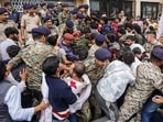 SFI activists clash with police personnel outside the vice-chancellor's office during a mega rally at Himachal Pradesh University, in Shimla on Wednesday. (ANI)