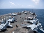 US sailors work on the flight deck of USS George Washington (CVN 73), Aug. 20, as the aircraft carrier transits the Arabian Sea. US sailors work on the flight deck of USS George Washington (CVN 73), Aug. 20, as the aircraft carrier transits the Arabian Sea.