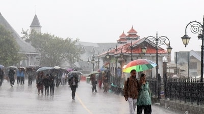 People walk under umbrellas amid heavy monsoon showers, in Shimla last week. (Satnam Gill/ANI Photo) People walk under umbrellas amid heavy monsoon showers, in Shimla last week. (Satnam Gill/ANI Photo)