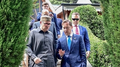 Jammu and Kashmir Chief Minister Omar Abdullah in conversation with US Ambassador to India Sergio Gor, in Srinagar on Wednesday. (ANI)