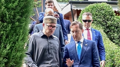 Jammu and Kashmir Chief Minister Omar Abdullah in conversation with US Ambassador to India Sergio Gor, in Srinagar on Wednesday. (ANI)