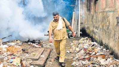 Mumbai...6th June 2011... News... Sanjay Jadhav, 46, a BMC worker fumigating the area with his TF35 Fogging Machine in the Aai Maai Merwanjee Lane in Parel area as a part of precautionary measures against Malaria during the monsoons - Photo by Kalpak Pathak (Hindustan Times)