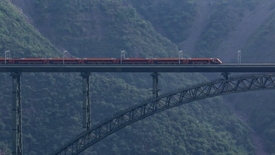 A Vande Bharat train runs on the railway track of the Chenab Bridge, in Reasi, Jammu and Kashmir. (PTI) A Vande Bharat train runs on the railway track of the Chenab Bridge, in Reasi, Jammu and Kashmir. (PTI)