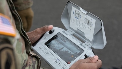 A U.S. Army servicemember using a small unmanned aircrafts system, or sUAS, controller. A U.S. Army servicemember using a small unmanned aircrafts system, or sUAS, controller.
