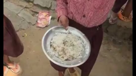 A clip from a video that went viral shows the food being served at Primary School Kotra in Tadiyawan development block of Hardoi. (Sourced)