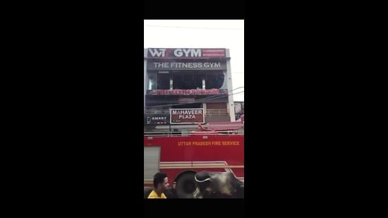 Five fire engines were rushed to the spot and it was found that five people were stuck on the terrace. (HT Photo)