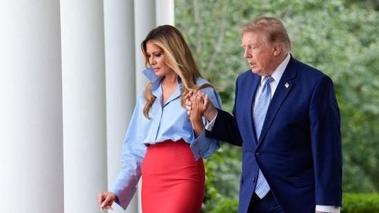 US First Lady Melania Trump, left, and US President Donald Trump arrive for a Fostering the Future event in the Rose Garden of the White House in Washington, DC, US. (Bloomberg)