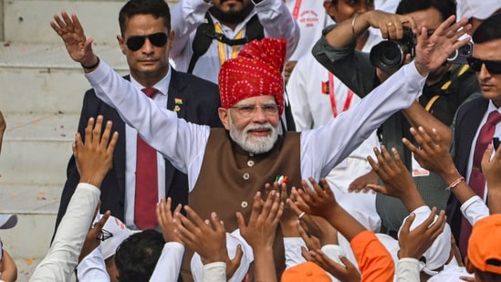 File photo of Prime Minister Narendra Modi with school children after delivering his 80th Independence Day speech from Red Fort on August 15, 2026. (Raj K Raj/HT Photos)