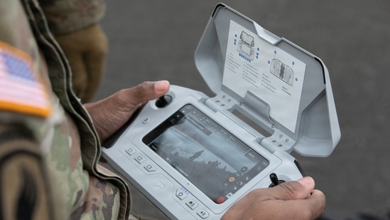 A U.S. Army servicemember using a small unmanned aircrafts system, or sUAS, controller.