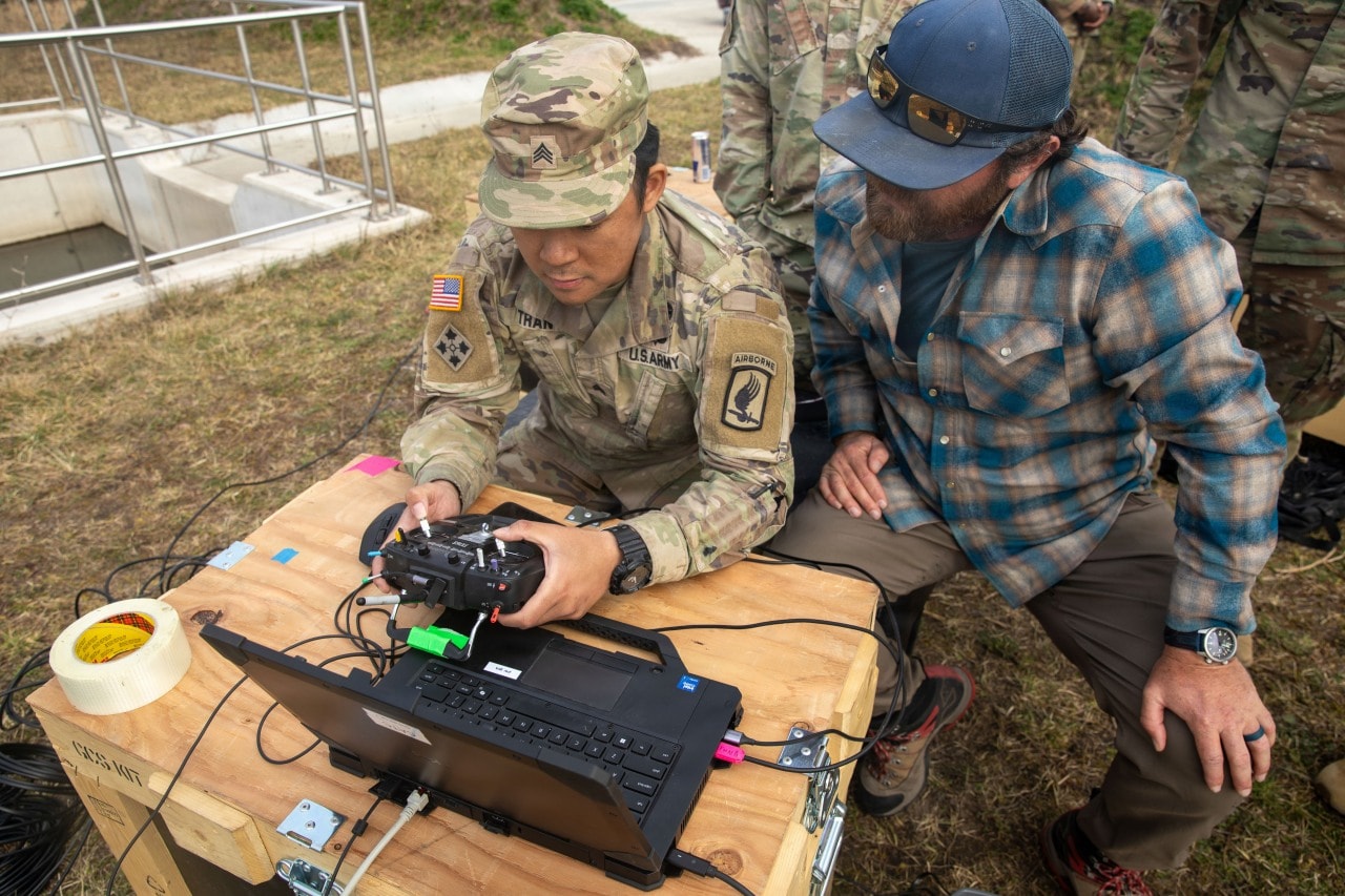 A soldier assigned to the 3rd Battalion, 504th Parachute Infantry Regiment, receiving instruction on operating a one-way attack drone at a training area in Germany in March. A soldier assigned to the 3rd Battalion, 504th Parachute Infantry Regiment, receiving instruction on operating a one-way attack drone at a training area in Germany in March.