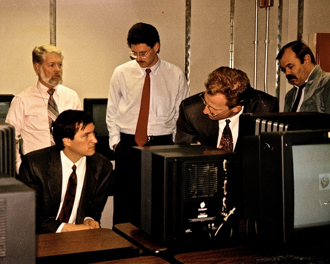 Jobs, seated, and Dain Ehring, standing, right, in a room used for top secret work in 1988.