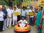 AAP party protesting outside MC office in Sector 17, Chandigarh, on Thursday. (Keshav Singh/HT)