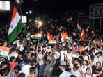 JPSC-JSSC aspirants wave the national flag as they celebrate after the Jharkhand government accepted their demands recently.