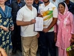 Lok Sabha LoP Rahul Gandhi and Sahil Lochav show the FIR copy after Delhi Police registered an FIR on Lochav's complaint as he had suffered pellet gun injuries during the July 20 protest.(@INCIndia/X)