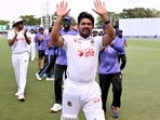 Bangladesh captain Najmul Hossain Shanto waves to the fans after his team's victory in the first Test.