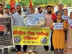 Computer Teachers protesting at the DC office in Ludhiana on Thursday. (Manish/HT)